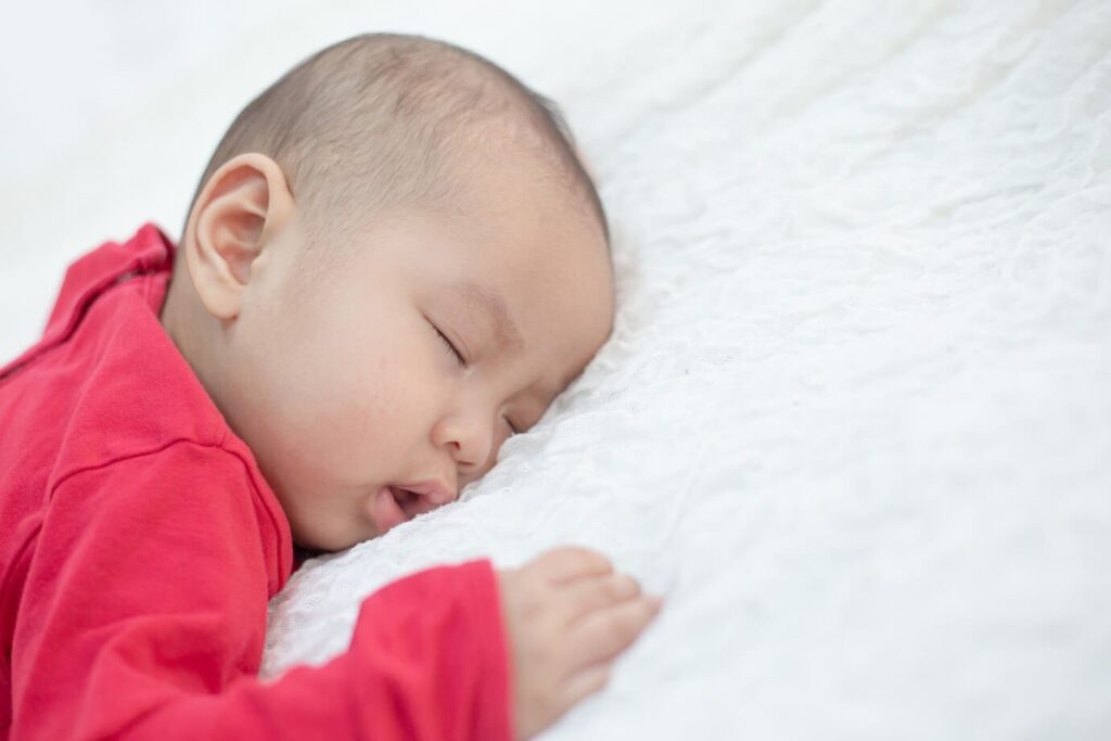 baby sleeping face down in mattress