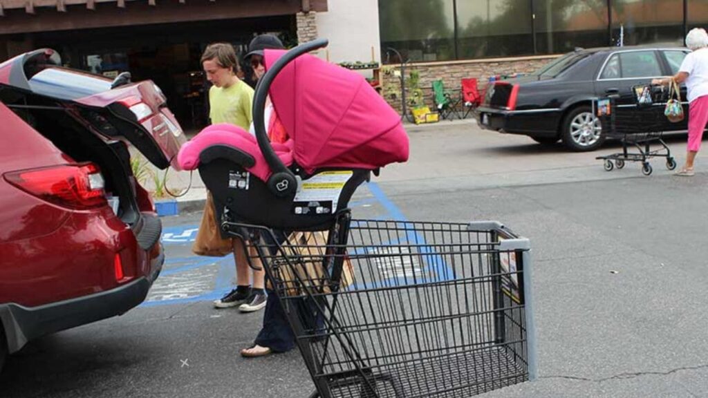 How to put a car seat on a shopping cart 3